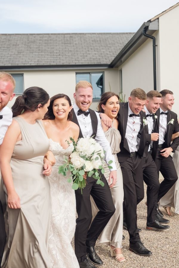 Candid wedding party moment in soft light