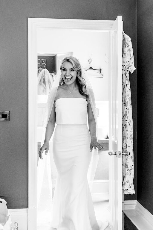 Bride reveals her dress to bridesmaids at Pendrell Hall