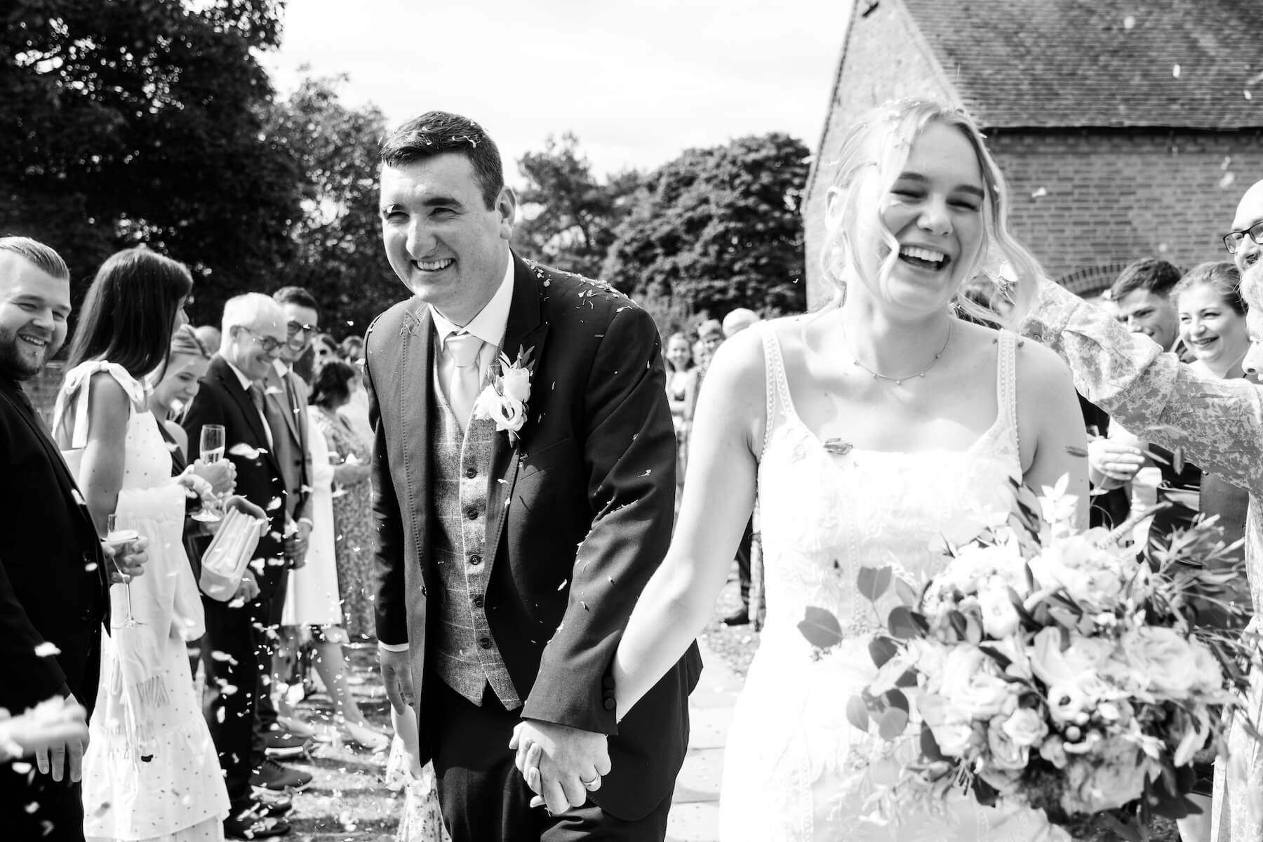 Confetti shot of the bride and groom at Alrewas Hayes