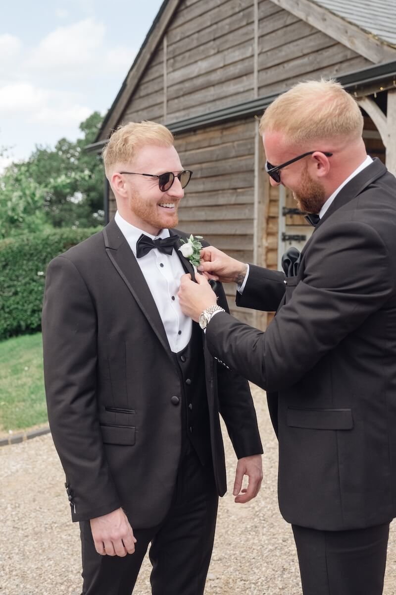 Groom with his groomsmen in black tie attire