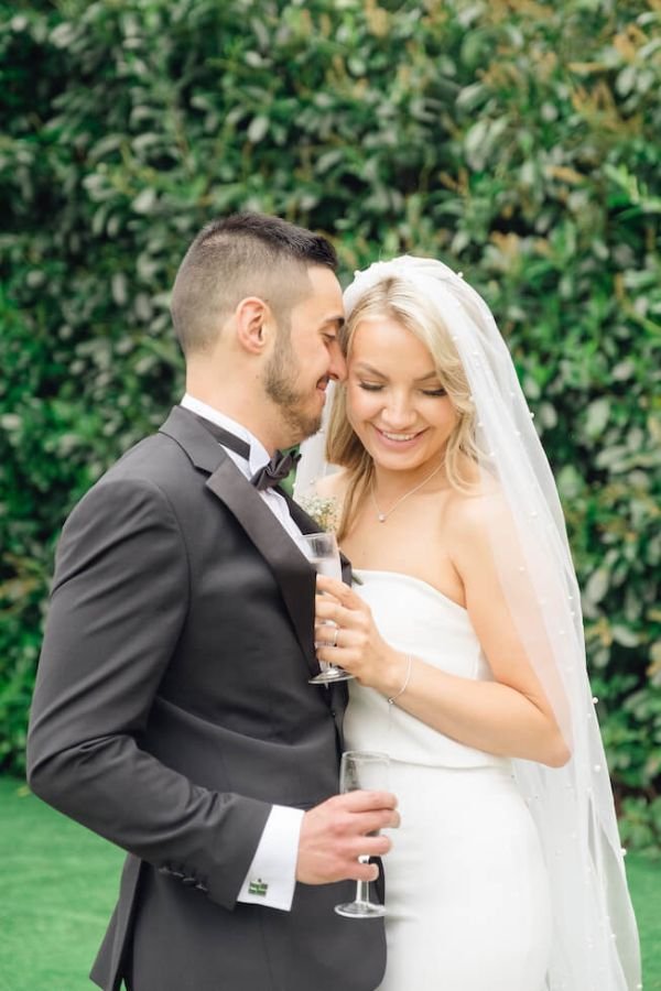 Second photographer capturing a guest reaction at a London wedding