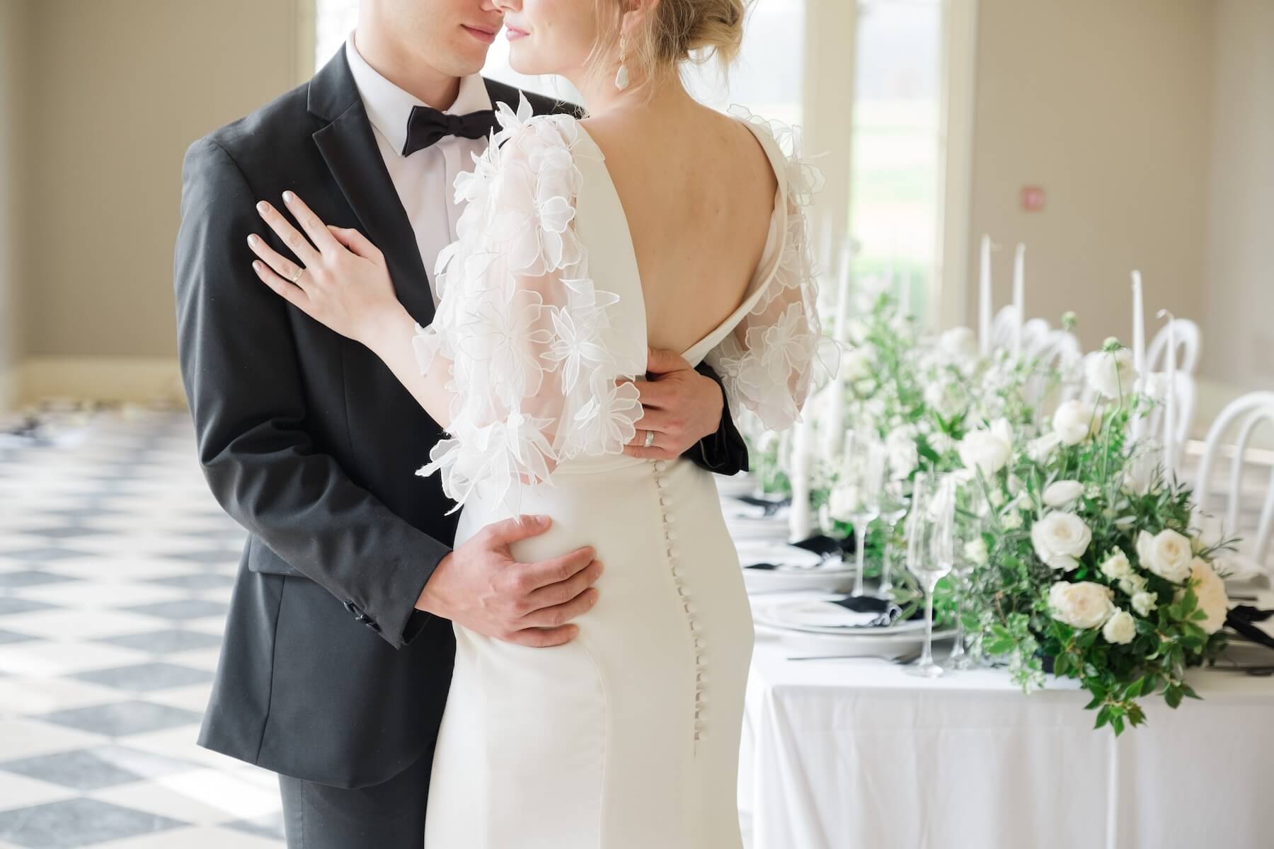 A black tie wedding, the bride and groom in formal black tie attire