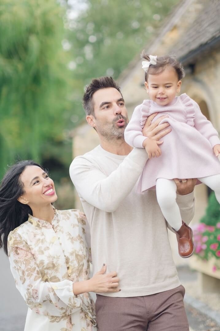 Family laughing together in the Cotswolds