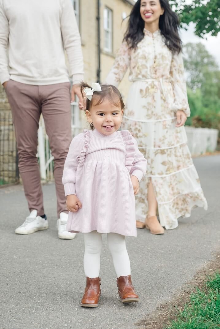 Young child laughing during a Cotswolds family photo session