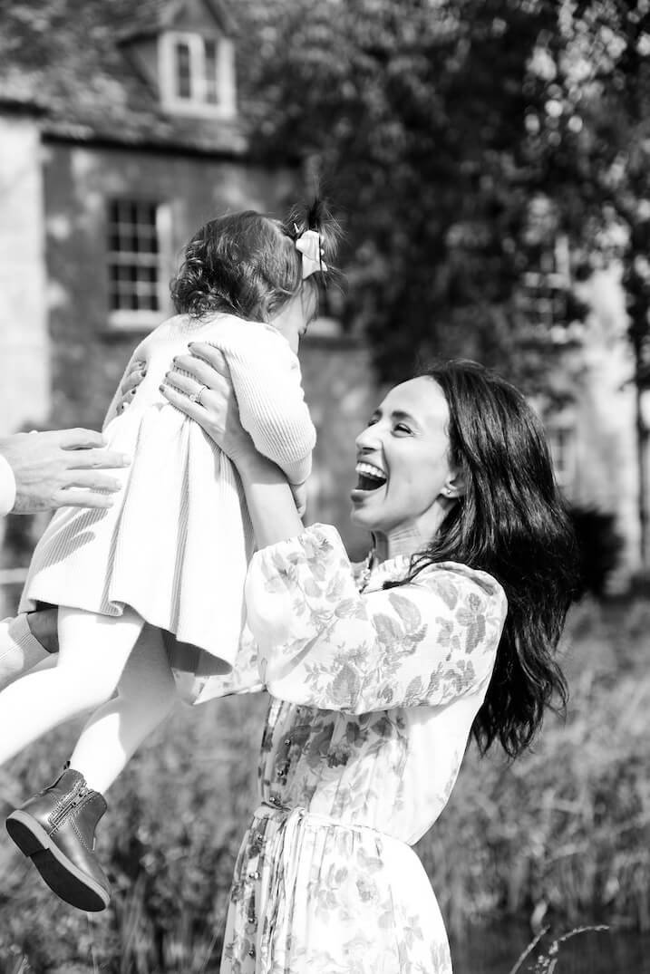 Natural family moment outdoors with a Cotswolds photographer