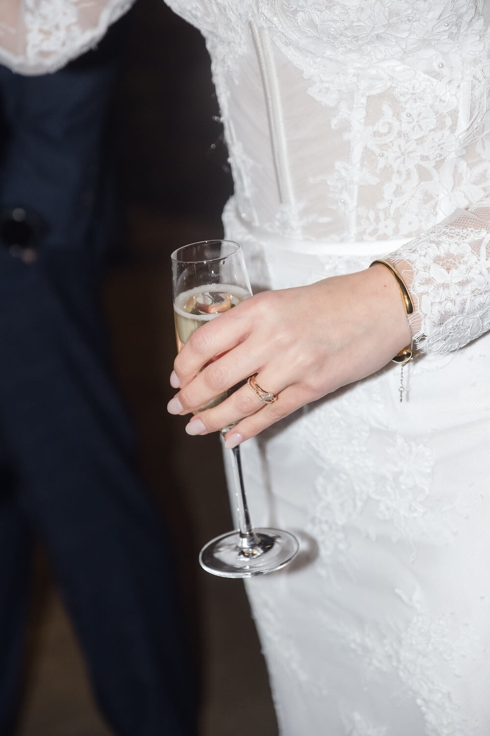 Bride holding champagne at Grange Wedding Barn Cheshire