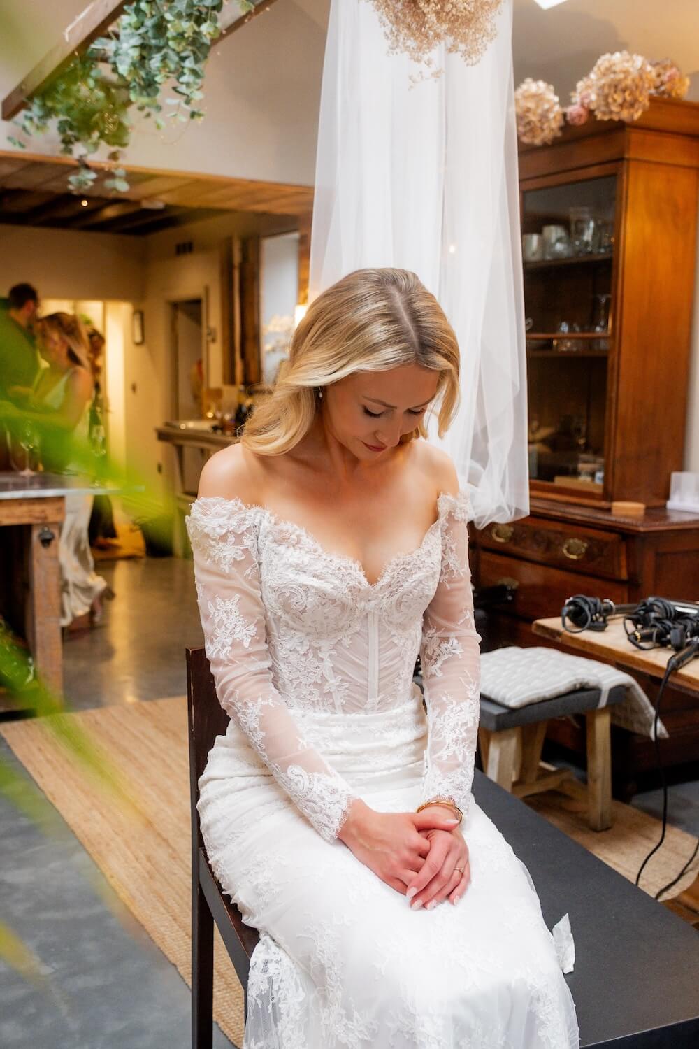 Bride waiting quietly before her wedding at Grange Wedding Barn Cheshire