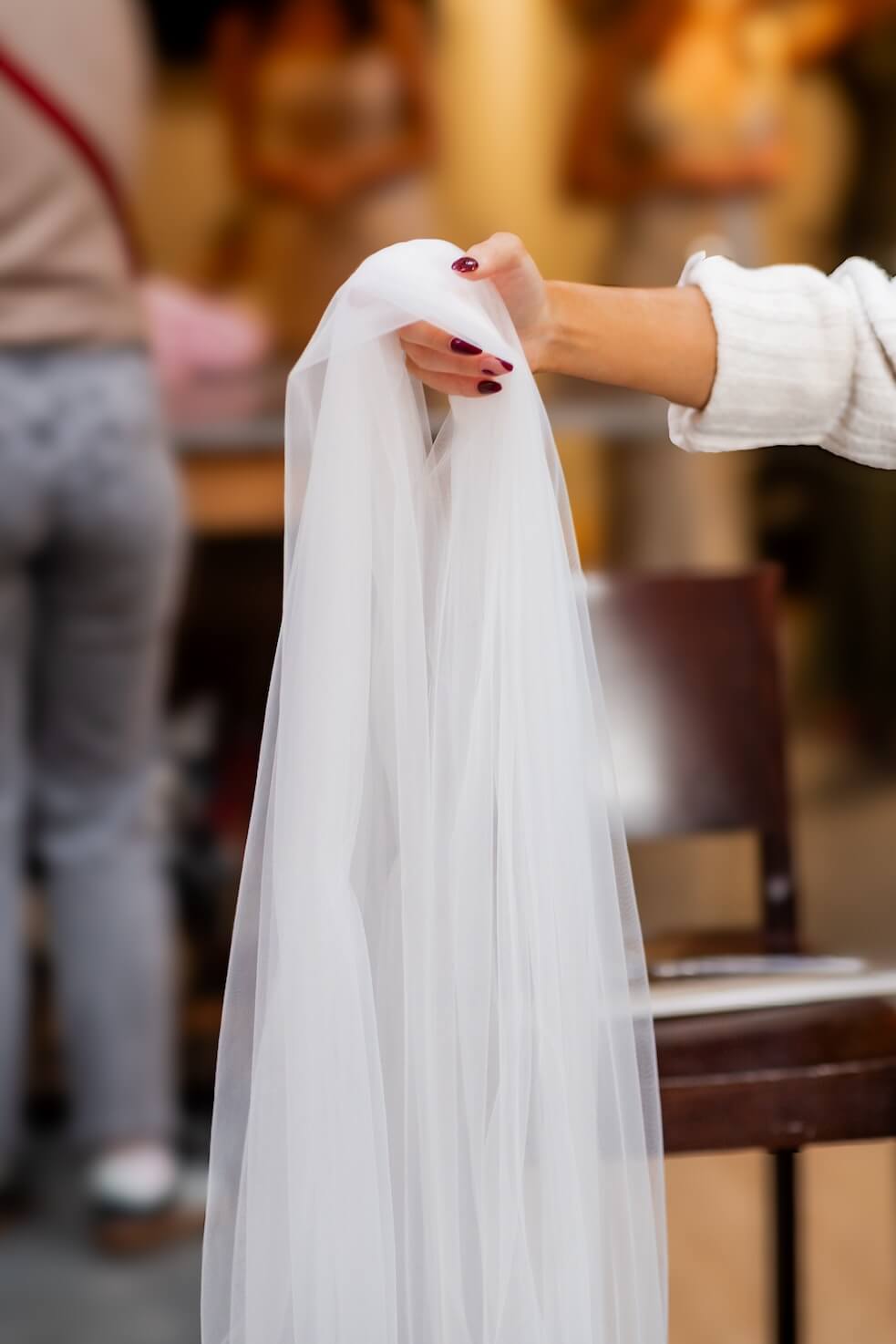 Hand holding the veil at Grange Wedding Barn Cheshire