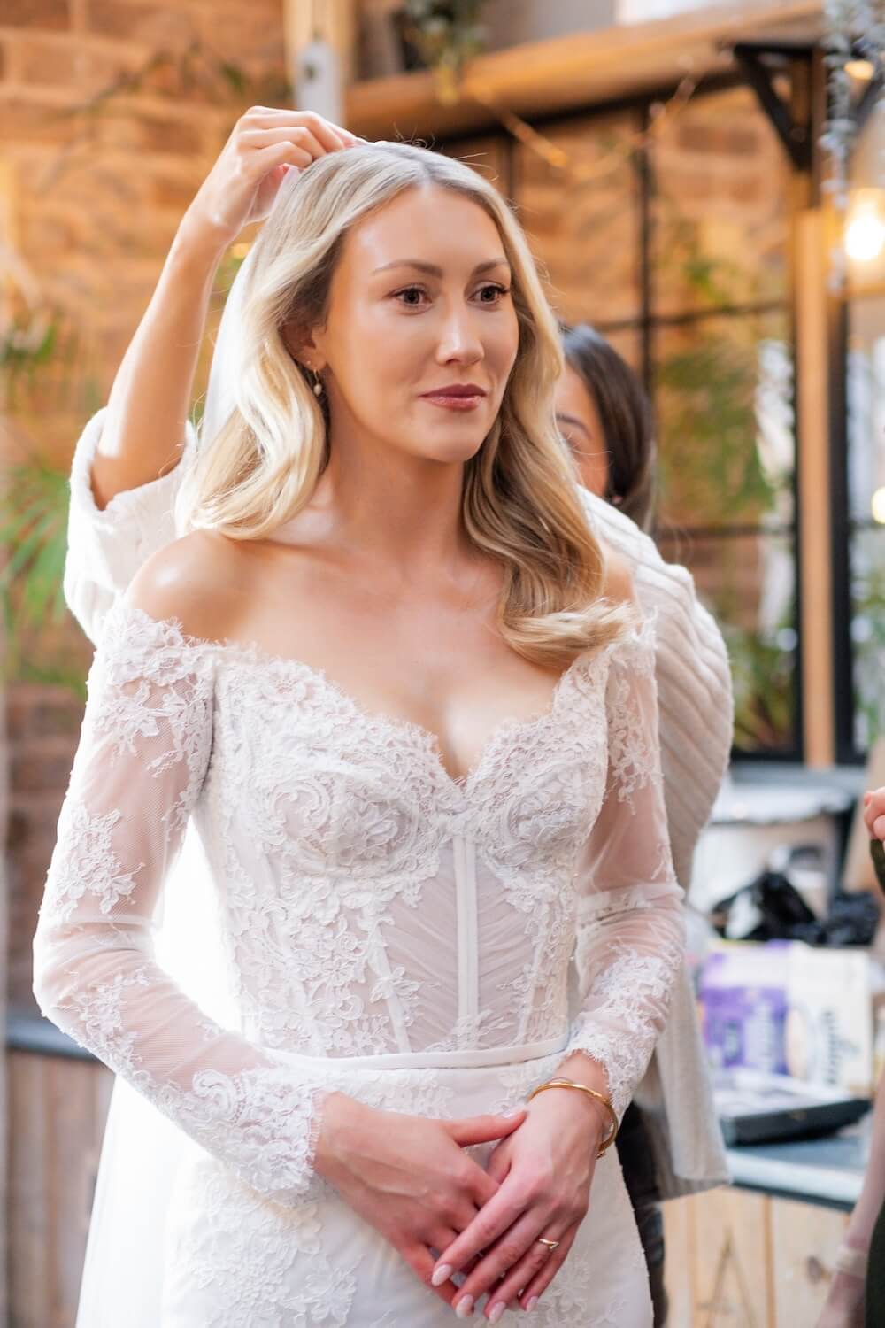 Bride having her veil attached at Grange Wedding Barn Cheshire