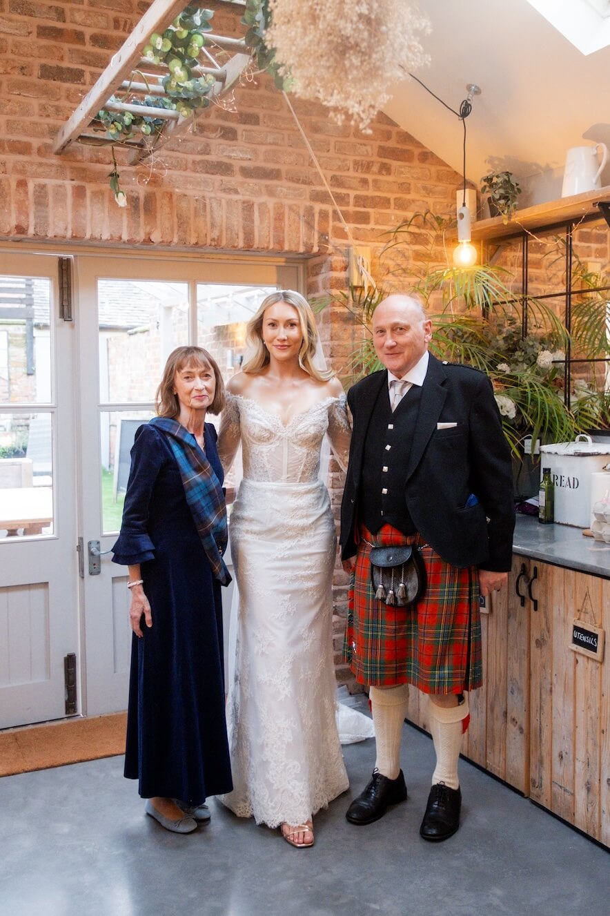 Bride with her mum and dad at Grange Wedding Barn Cheshire