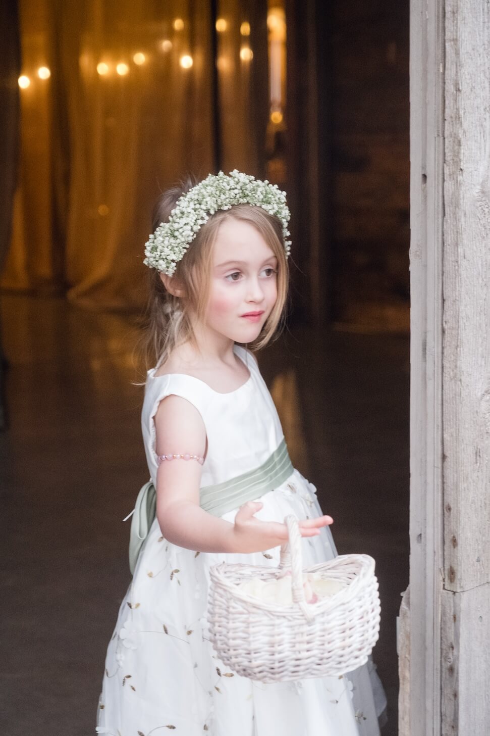 Flower girl in her dress before the ceremony