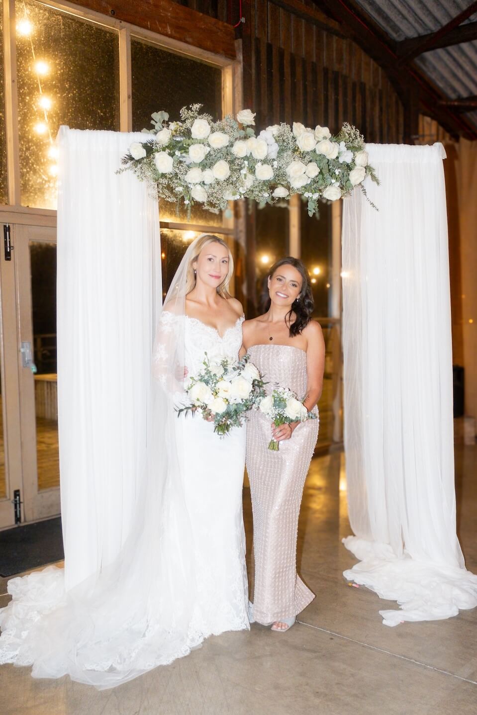 Bride with a bridesmaid at Grange Wedding Barn Cheshire