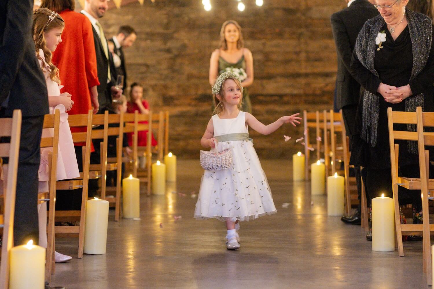 Petal girl walking down the aisle at Grange Wedding Barn Cheshire