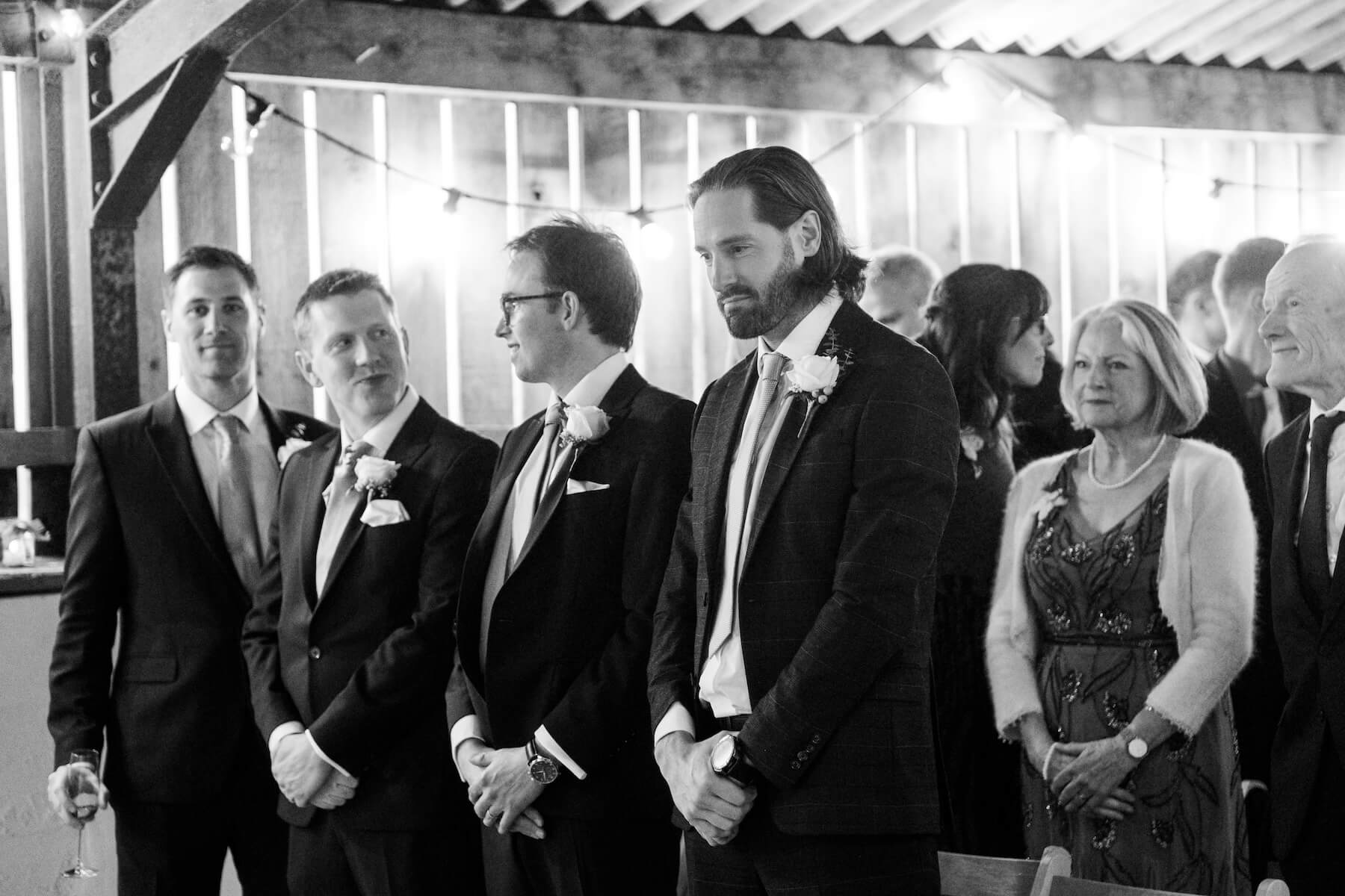 Black and white candlelit ceremony at Grange Wedding Barn Cheshire