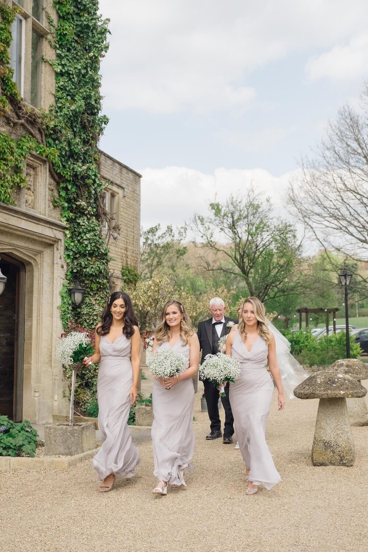 Bridal party walking to the ceremony at Hyde House