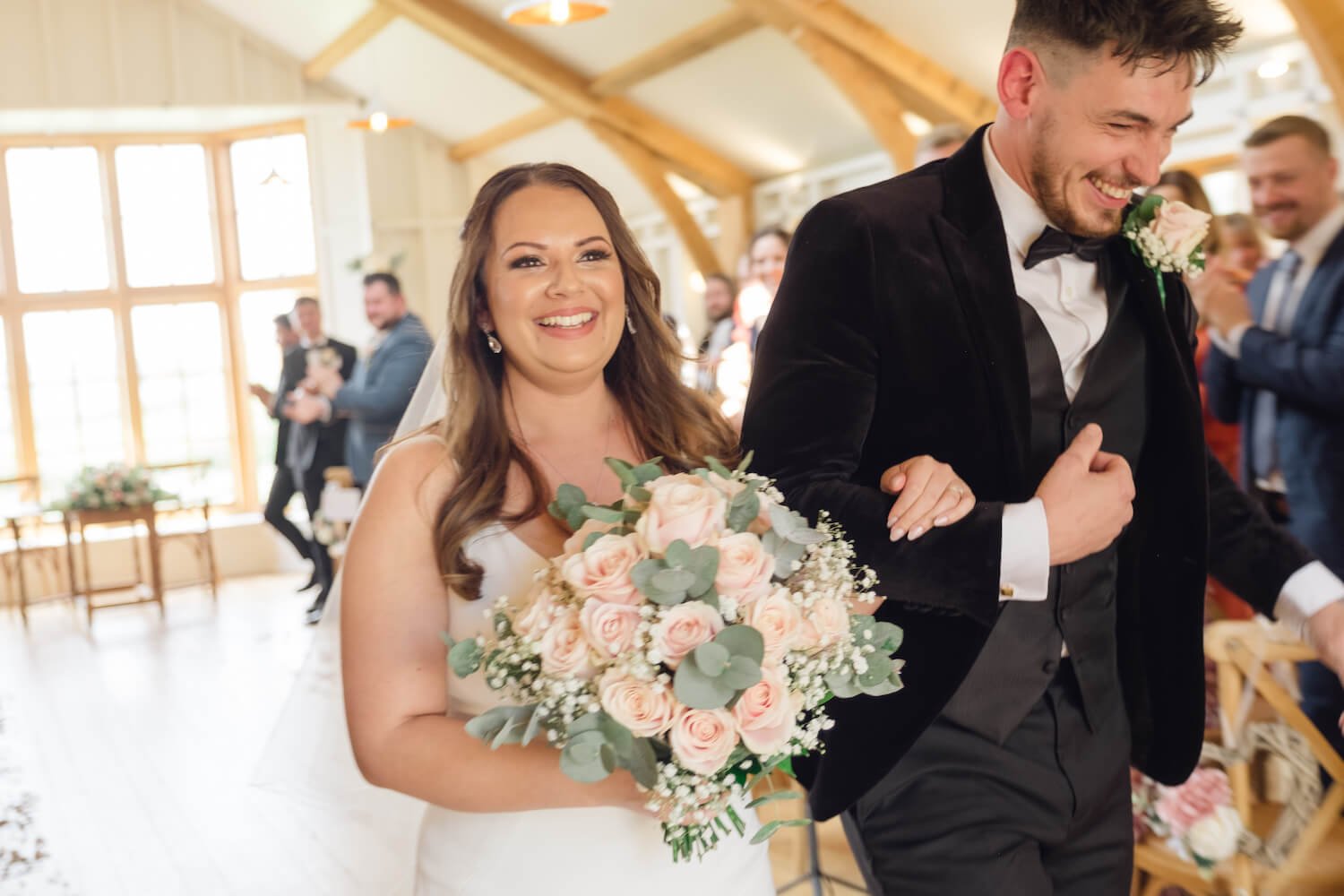 Just married, walking out of the ceremony at Hyde House
