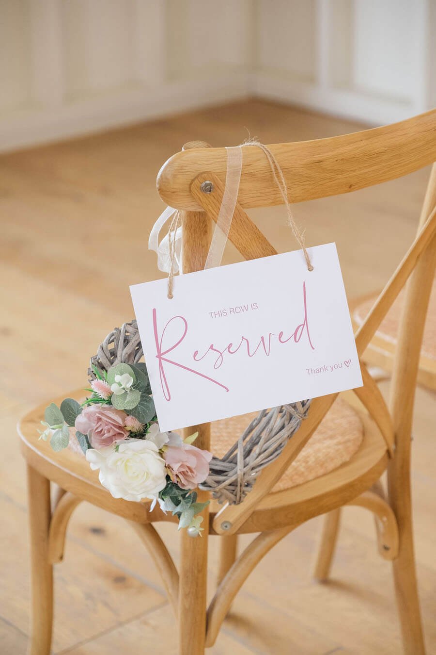 Flowers decorating a ceremony chair
