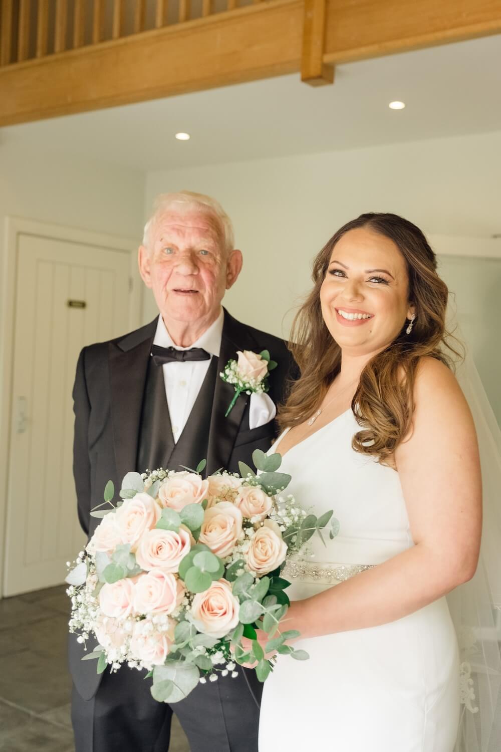 Bride with her father seeing her ready for the first time at Hyde House