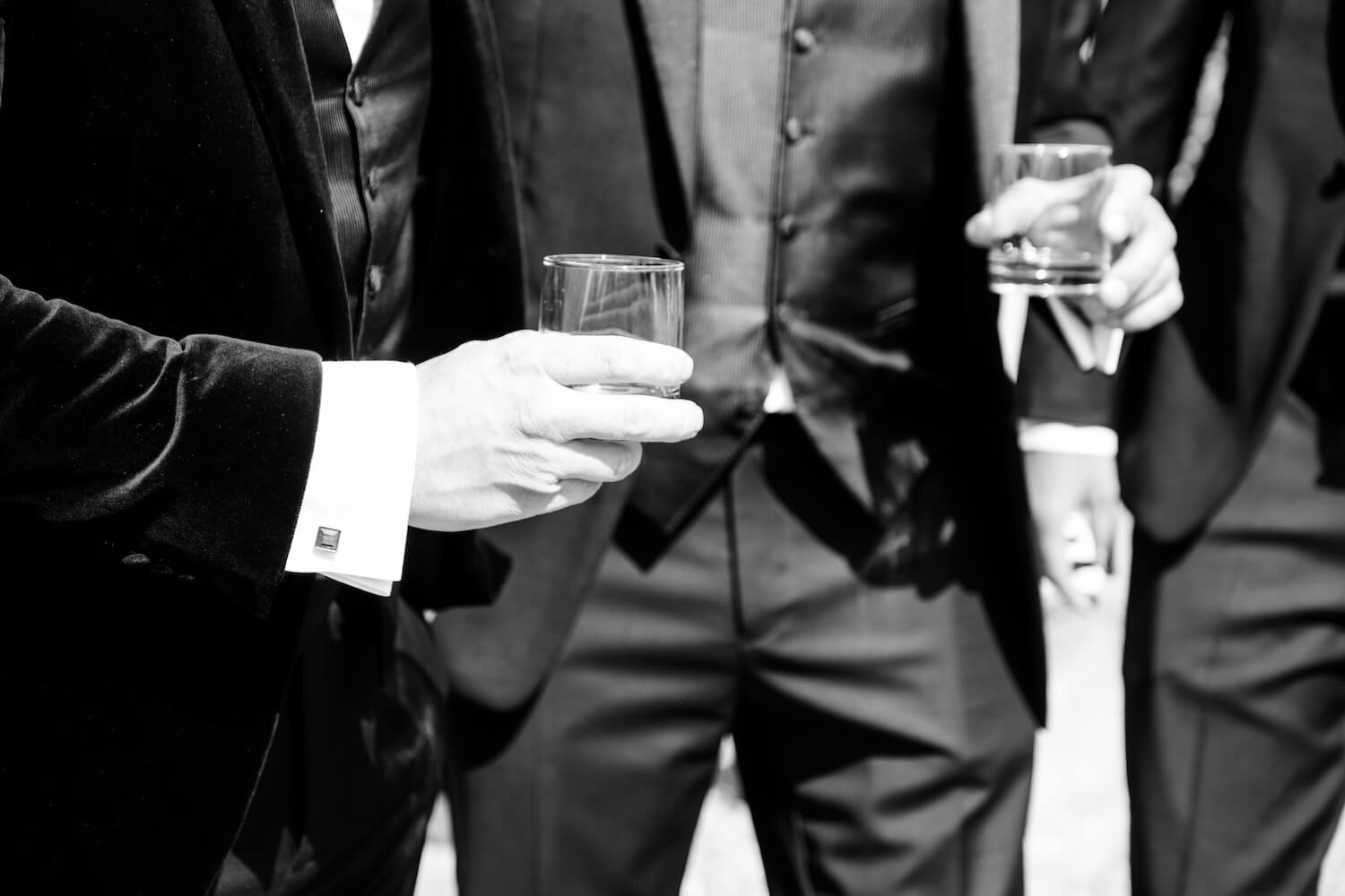 Groomsmen enjoying drinks together before the ceremony at Hyde House