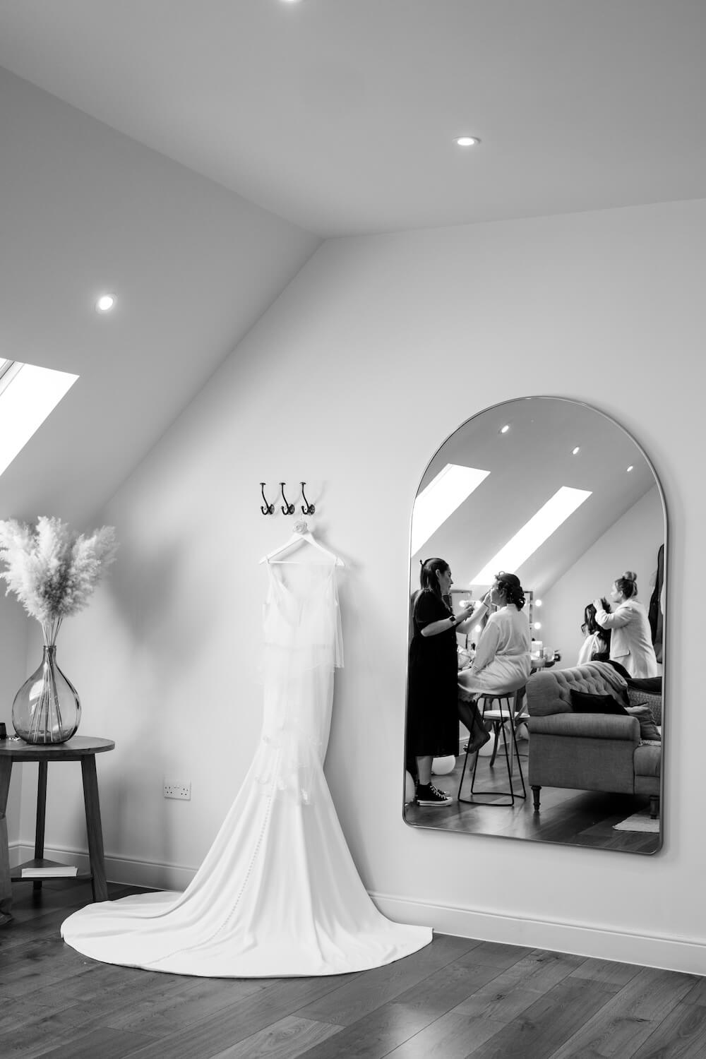 Wedding dress hanging in the bridal suite at Hyde House