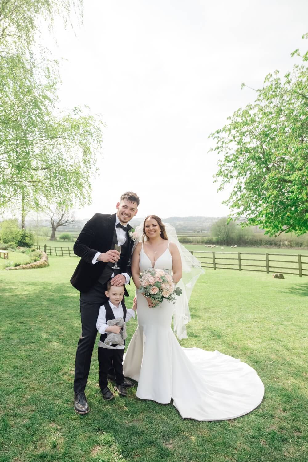 Bride, groom and their son at Hyde House