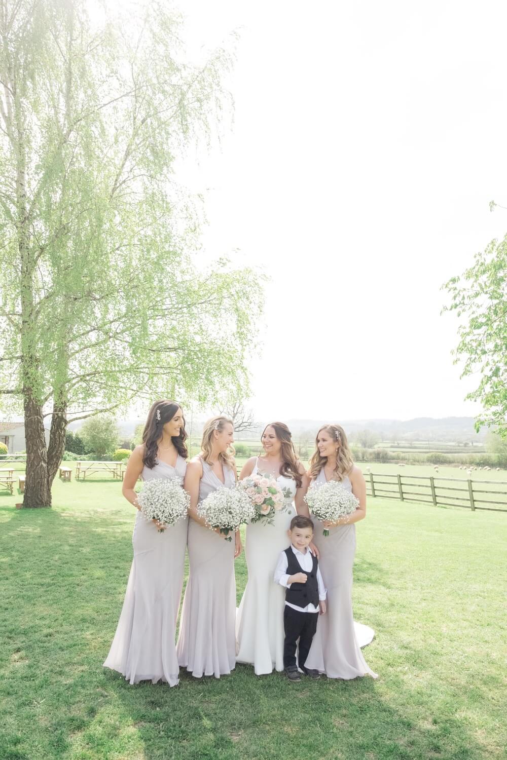 Bridesmaids with the couple's son at Hyde House