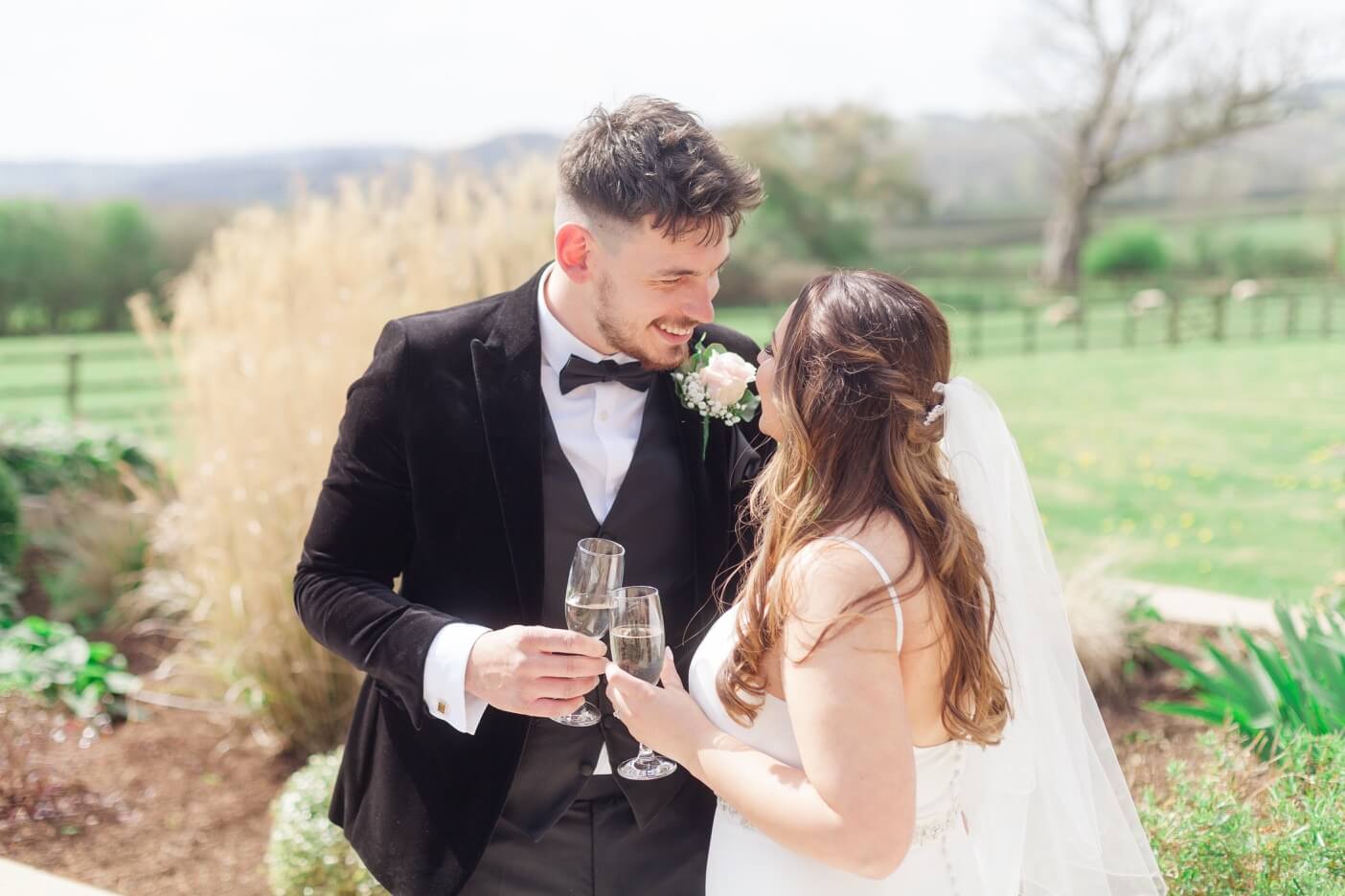 Bride and groom with champagne at Hyde House