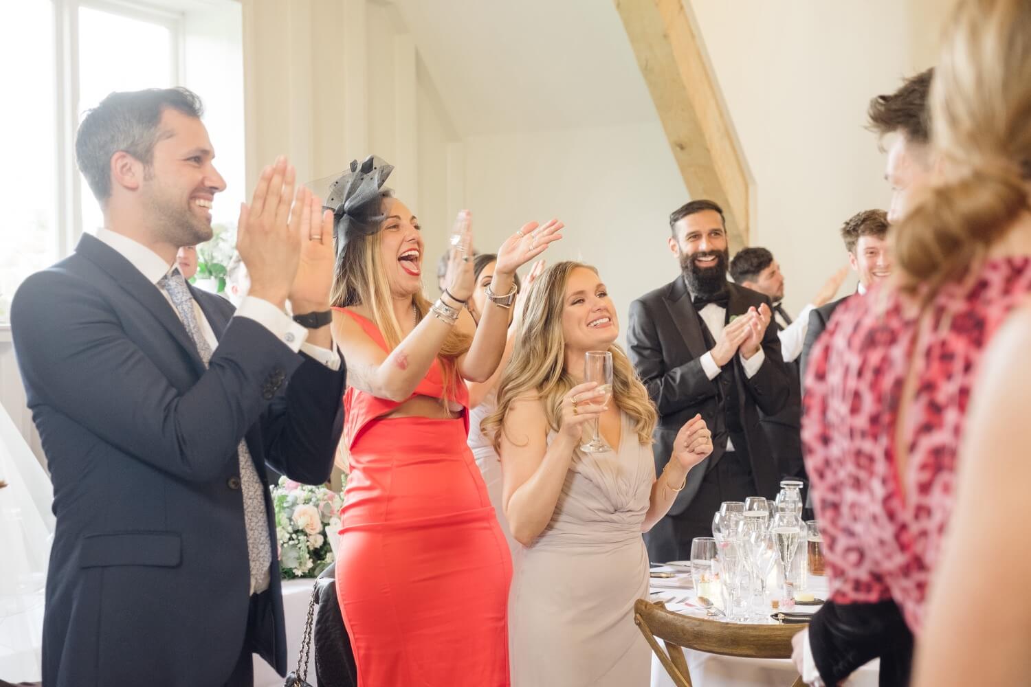 Guests on their feet clapping at Hyde House