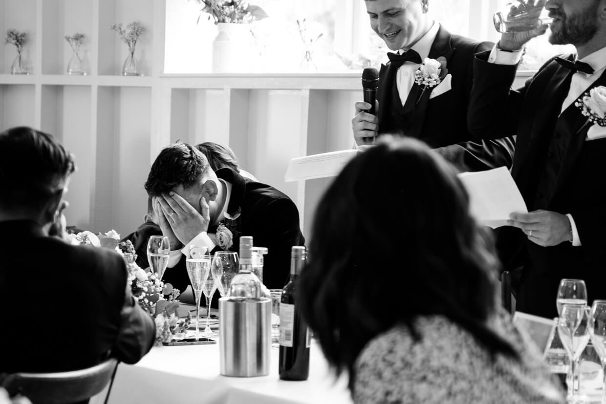 Best man's speech as the groom covers his eyes at Hyde House