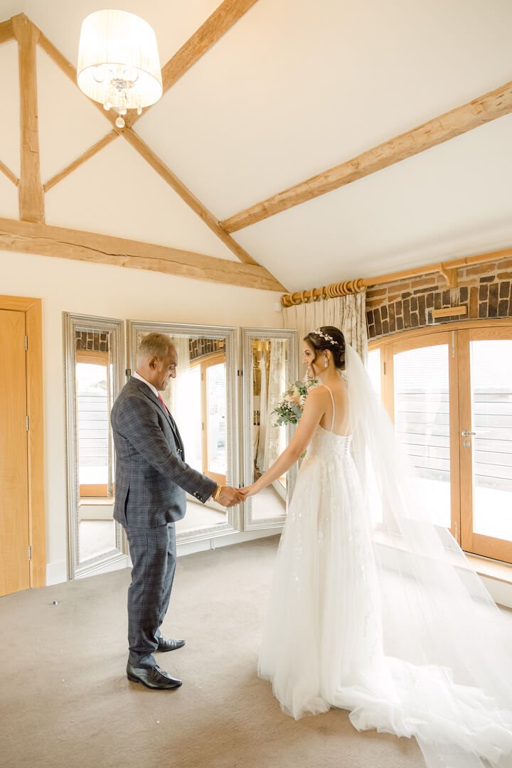 Final touches before a Mythe Barn wedding ceremony