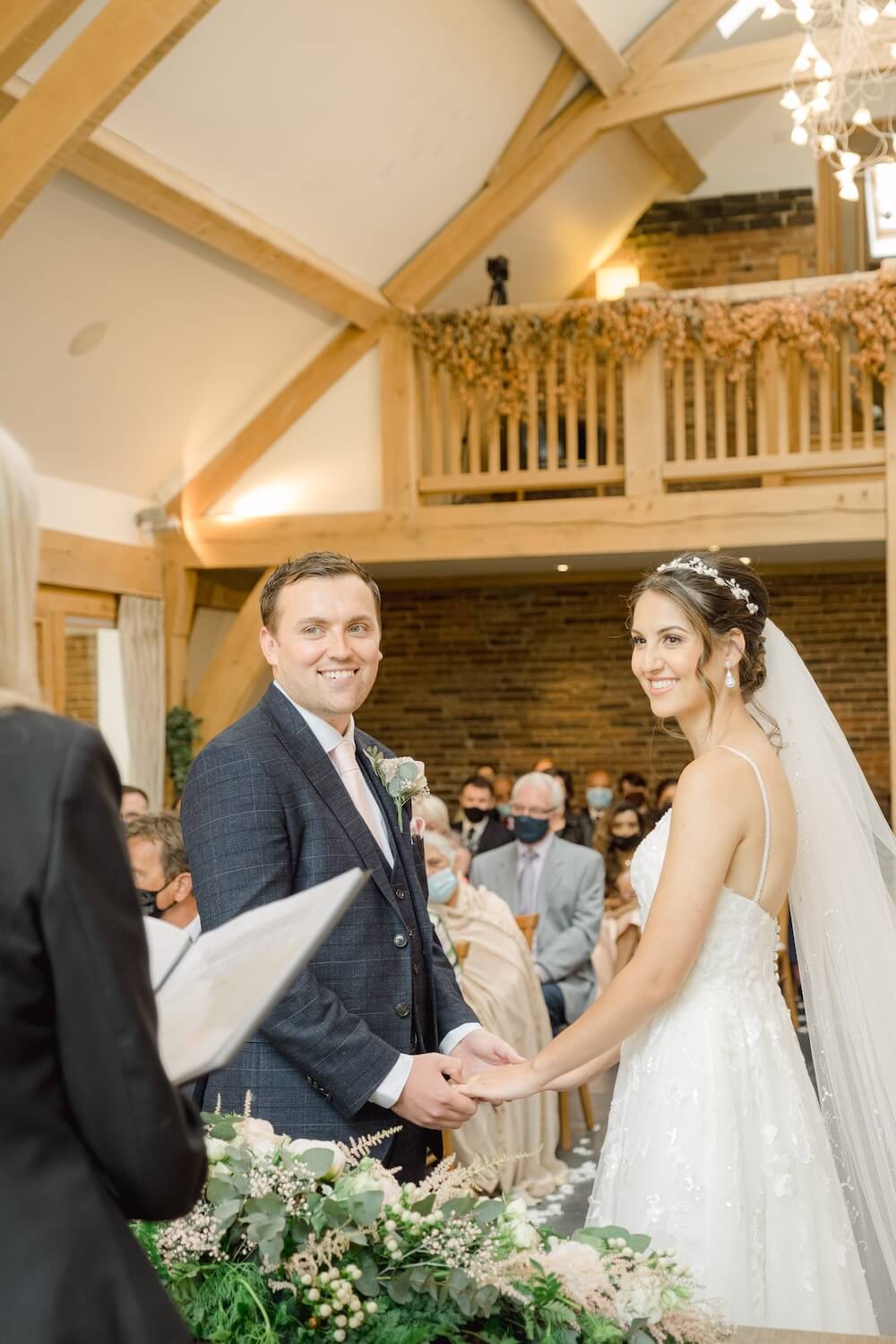 Wedding ceremony in the oak barn at Mythe Barn