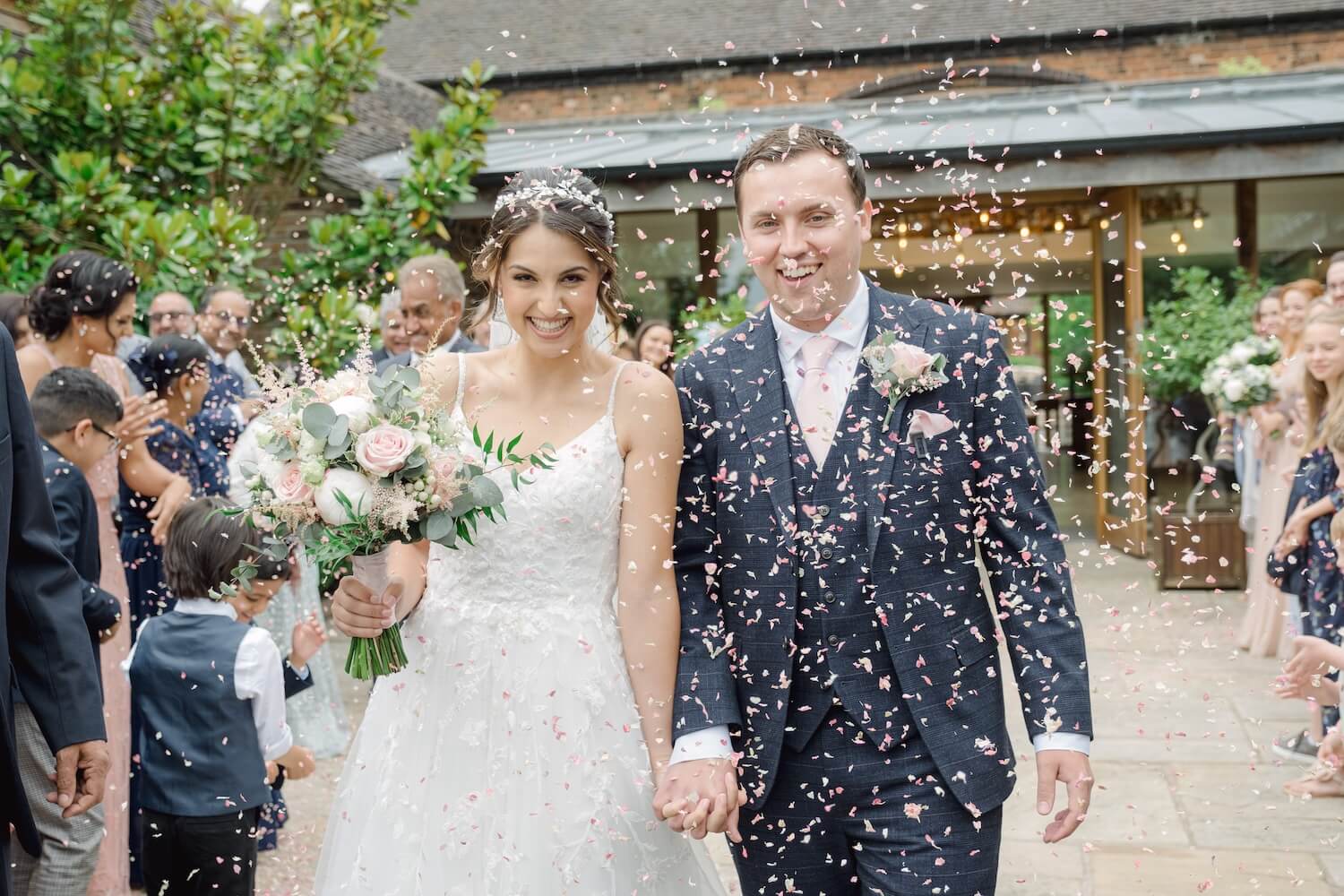 Confetti shot outside the oak barn at Mythe Barn