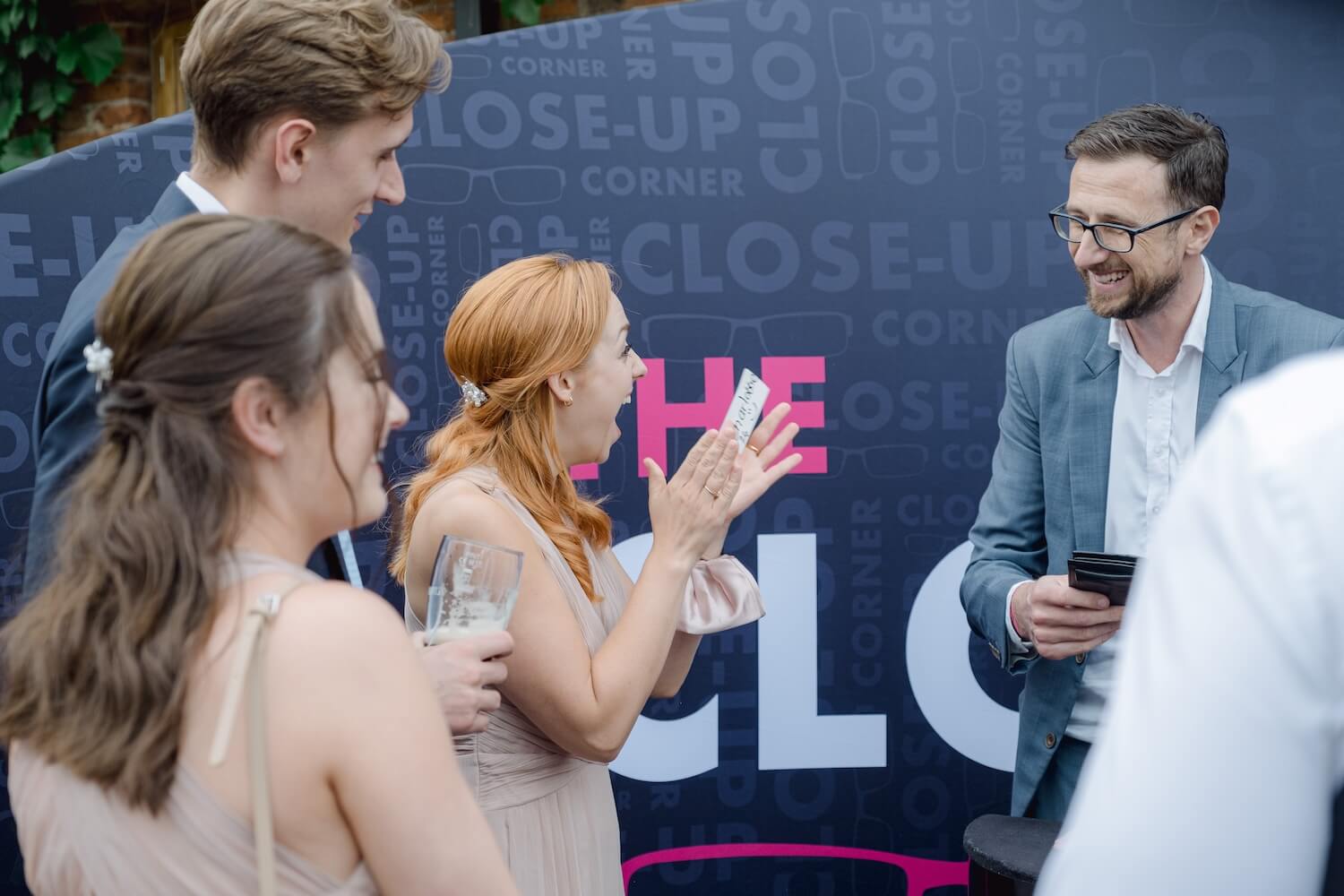 Guests reacting to the wedding magician at Mythe Barn