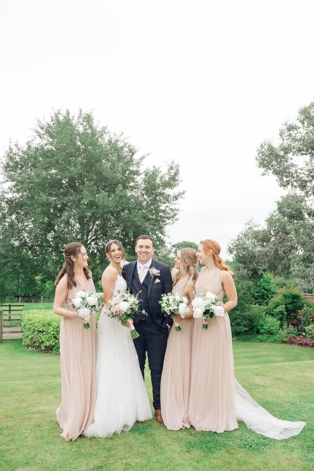 Bride, groom and bridesmaids at Mythe Barn