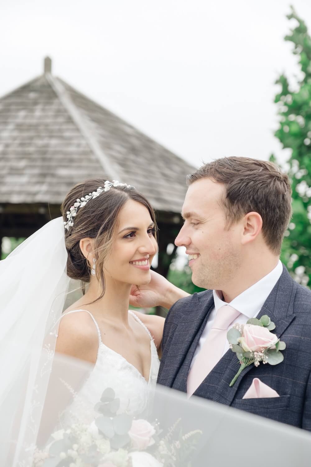 Close-up portrait of the bride and groom at Mythe Barn