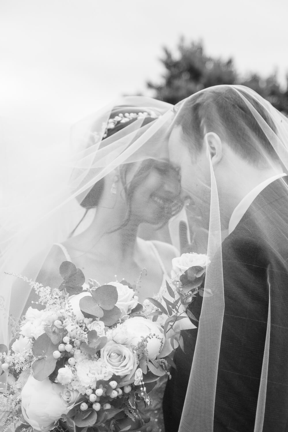 Black and white veil portrait of the bride and groom at Mythe Barn