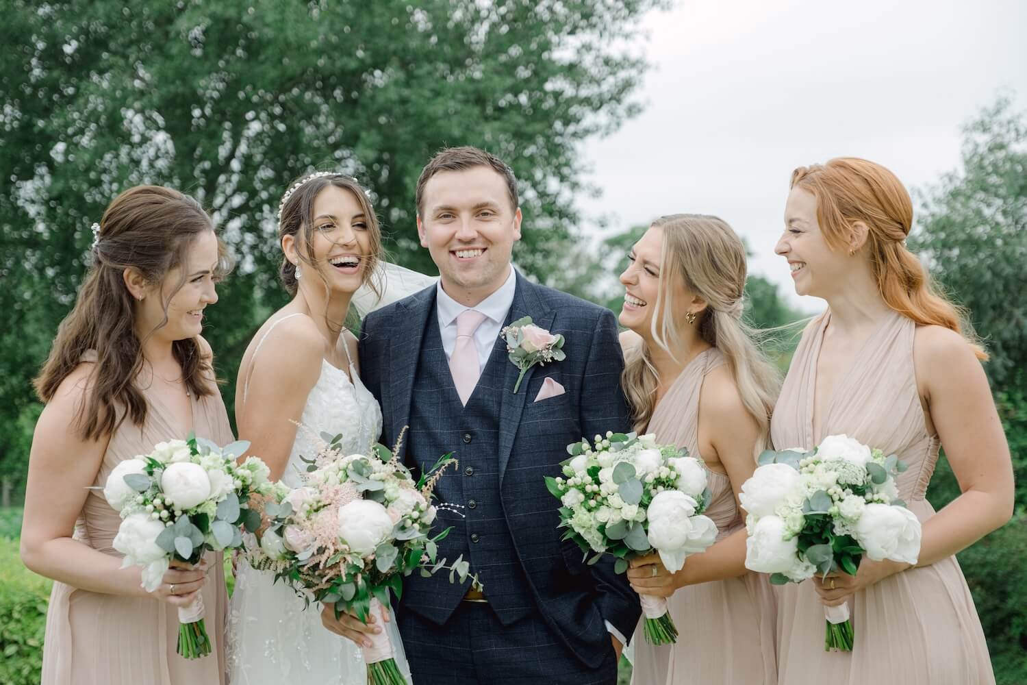 Bride and groom with their bridesmaids at Mythe Barn