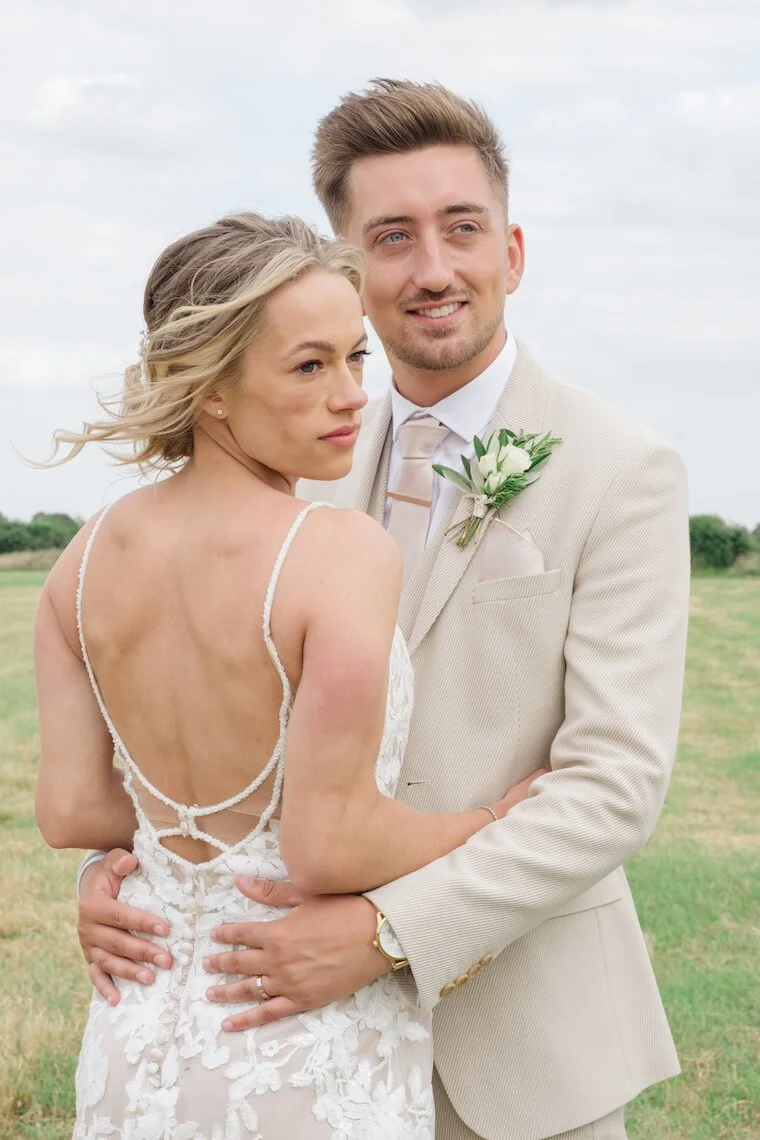 Bride and groom in the gardens at Stratton Court Barn