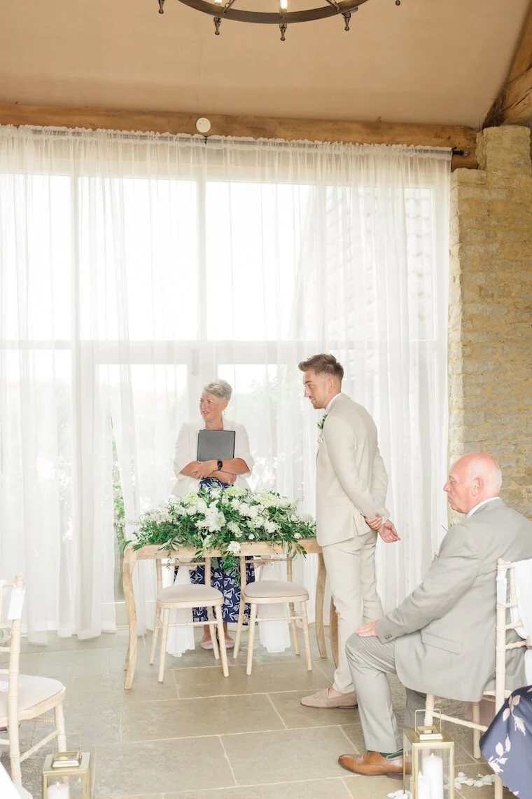 Groom waiting for his bride at Stratton Court Barn