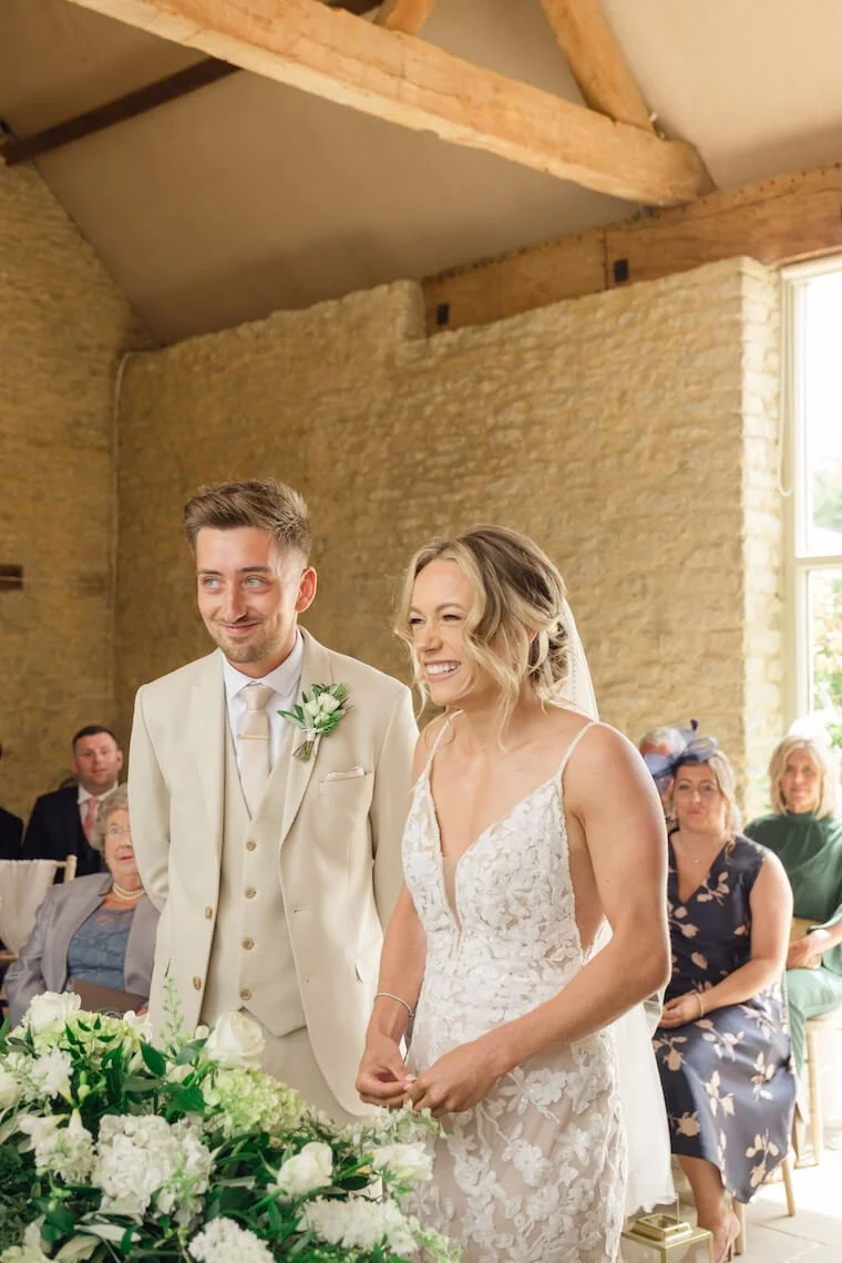 Bride and groom during their ceremony at Stratton Court Barn