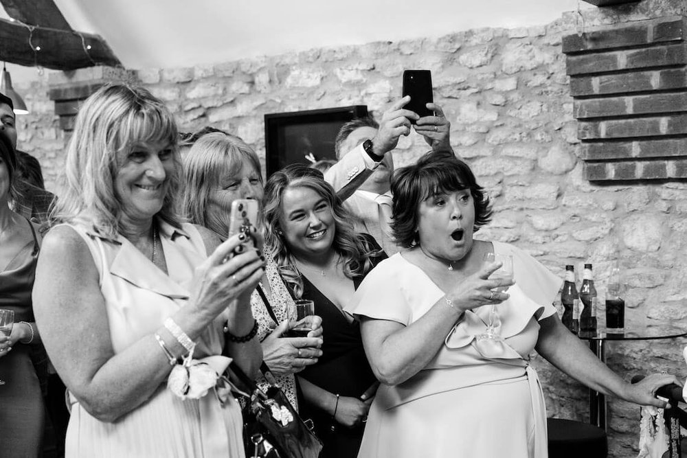 Guests reacting to the first dance at Stratton Court Barn