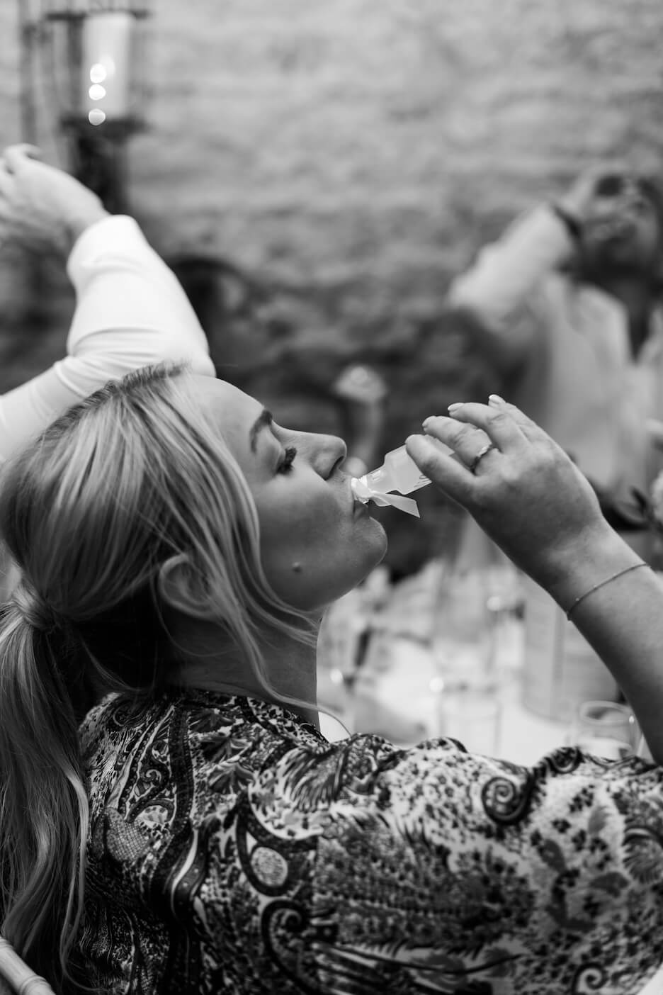 Guest drinking limoncello at a Stratton Court Barn wedding