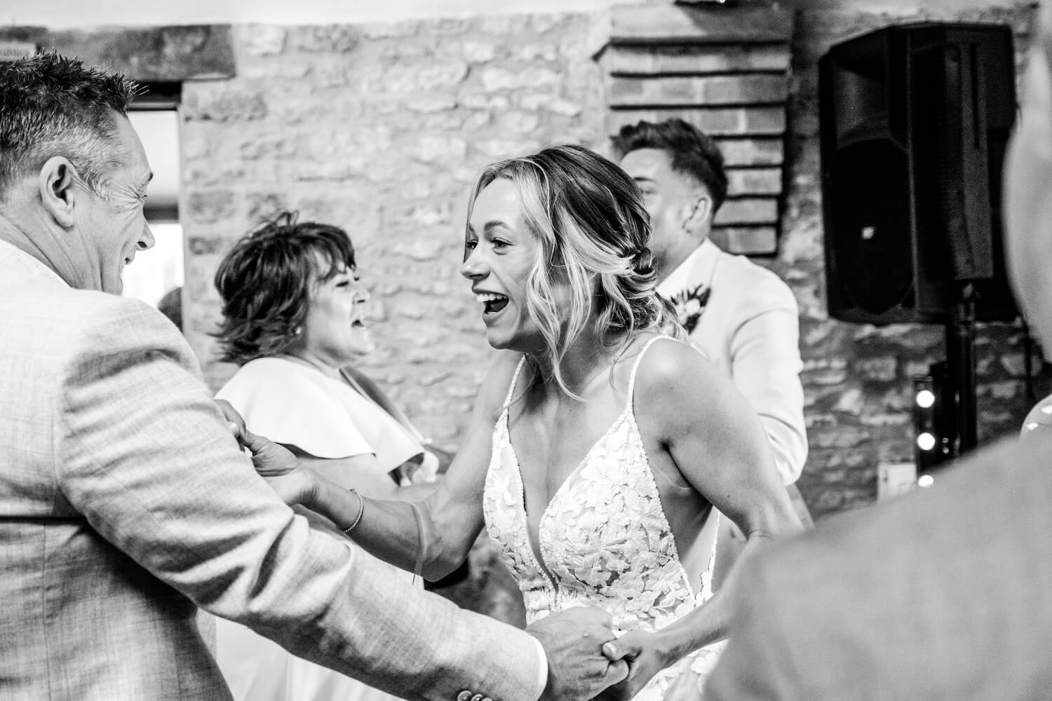 Guest dancing with the bride at Stratton Court Barn