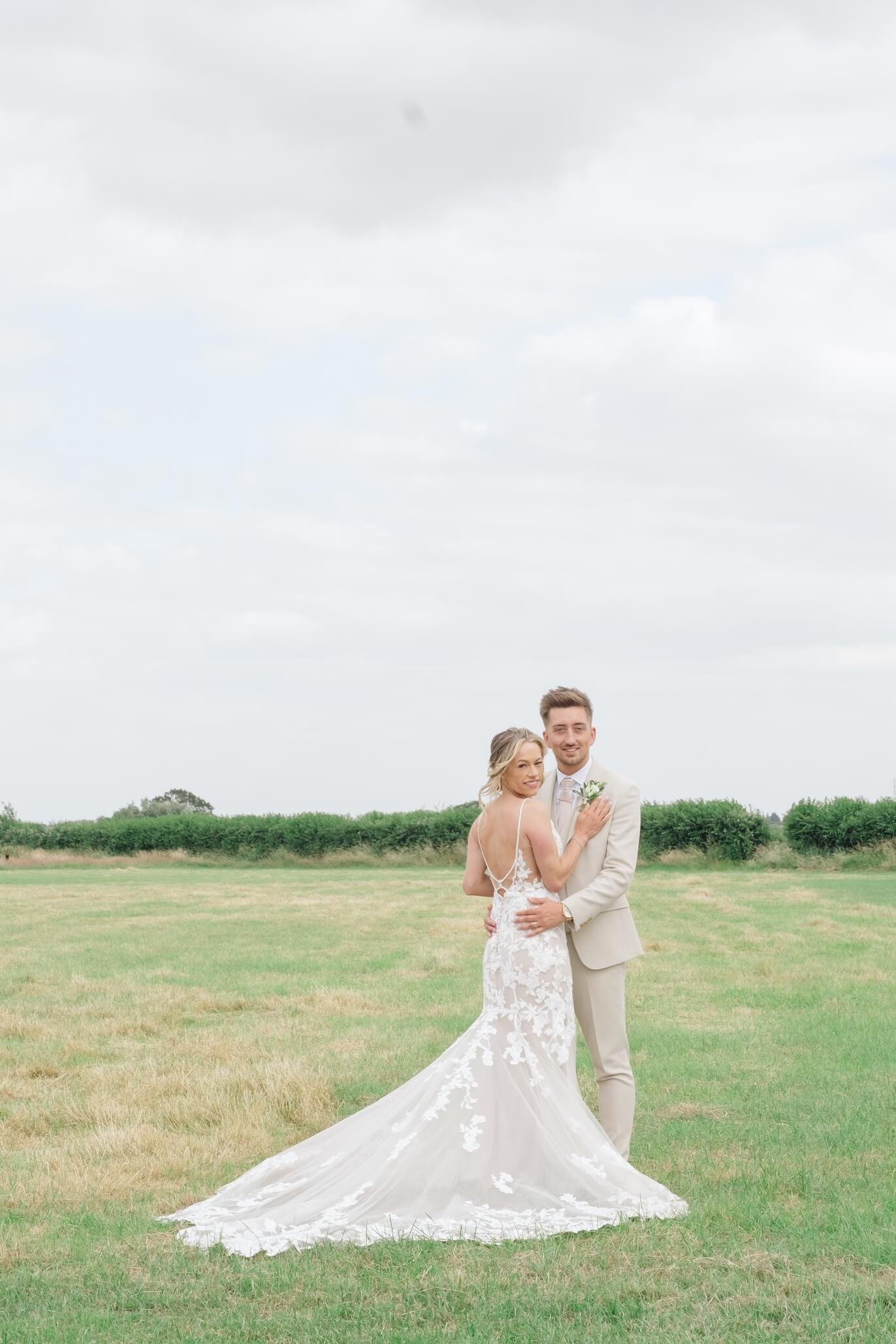 Black and white bride and groom portrait in the gardens at Stratton Court Barn
