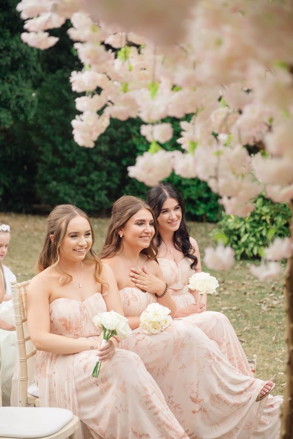 Bridesmaids during the ceremony at Warwick House