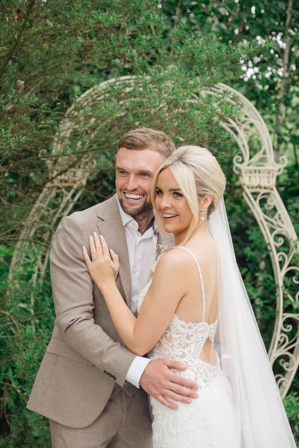 Bride and groom laughing at Warwick House
