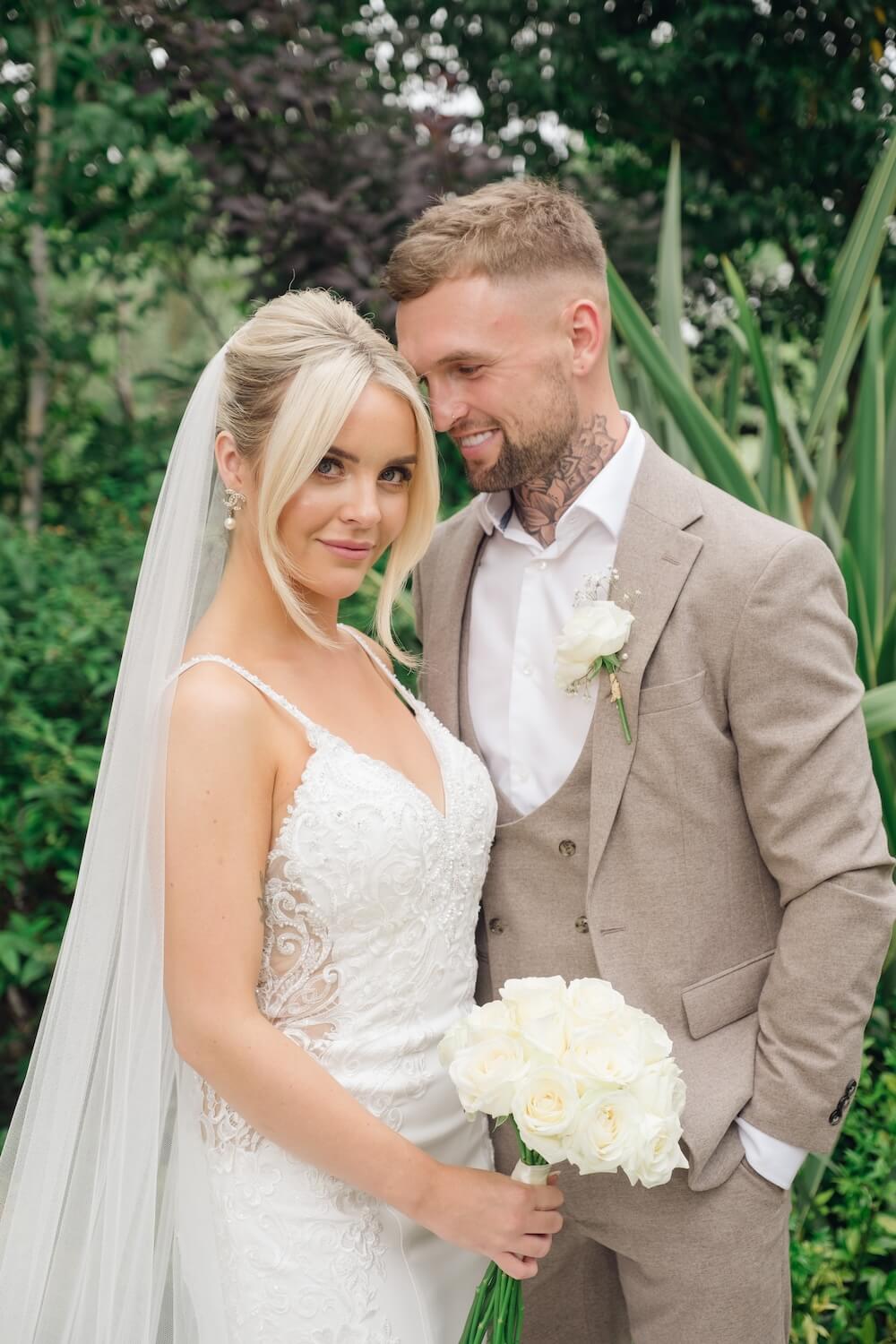 Couple with their wedding photographer