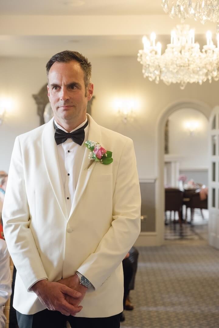 Groom waiting for the ceremony to begin at Weston Hall