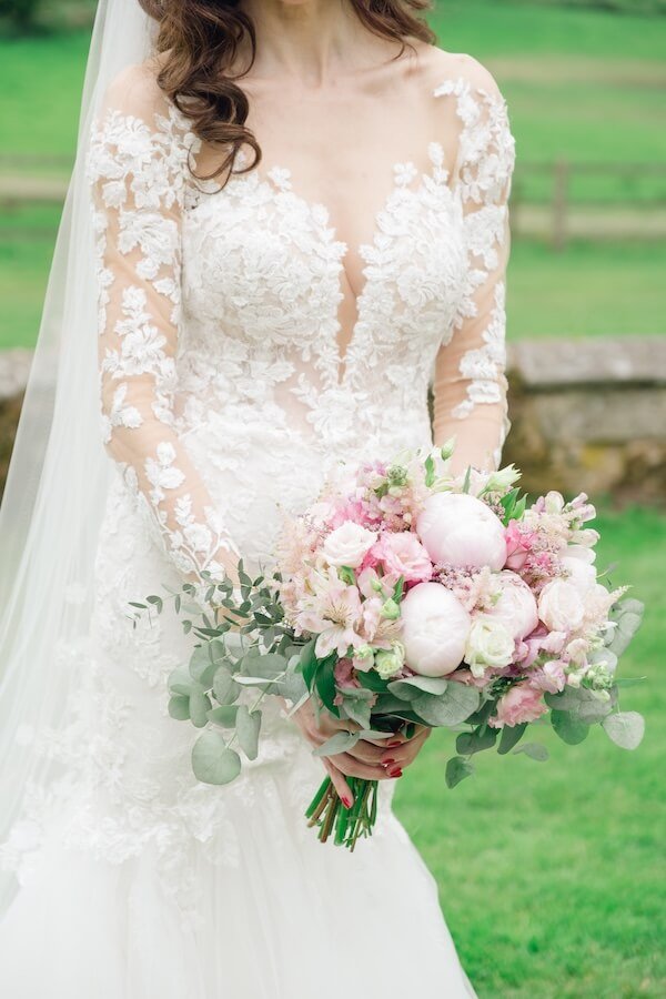 Bride with her bouquet in natural light