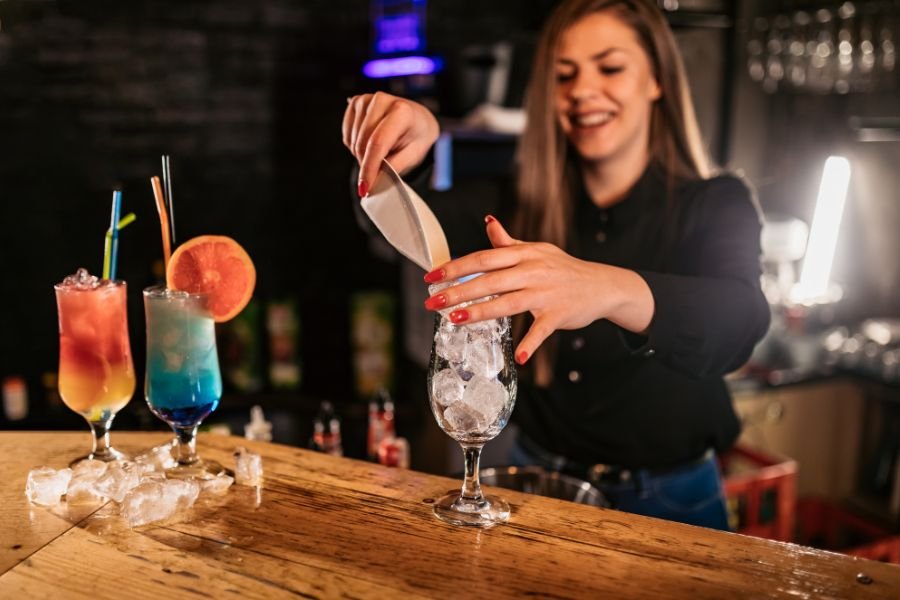 Cocktail maker preparing drinks at a classy hen party